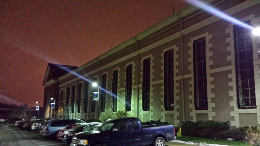 Nighttime with snow at Armory Artswalk Apartments